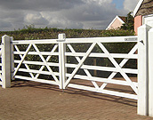 Double farm gates painted white.